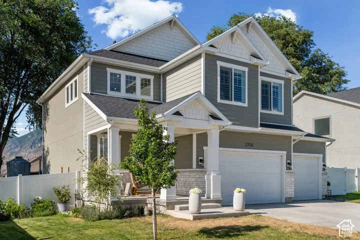 Two-story residence featuring a combination of horizontal siding and stucco exterior finishes