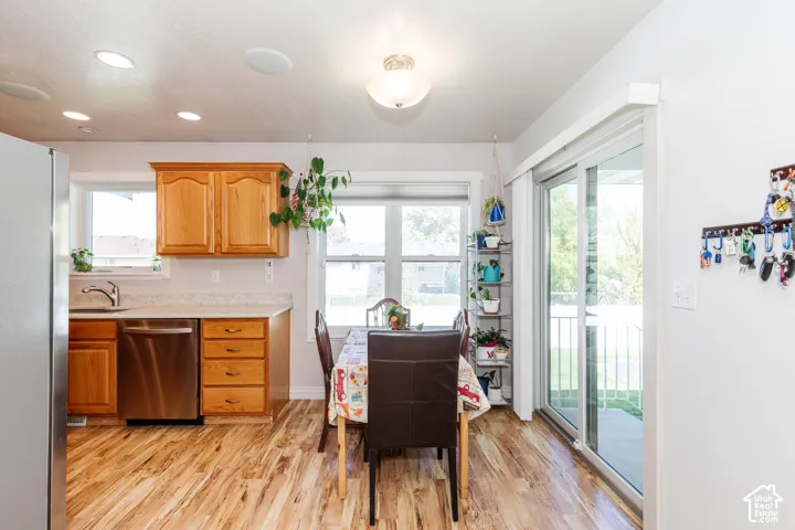 Kitchen featuring wood-finish flooring, recessed lighting, and wood cabinetry
