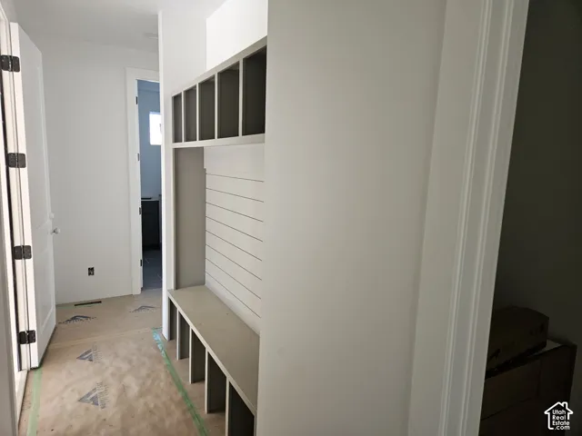 Built-in entryway storage with cubbies and a bench