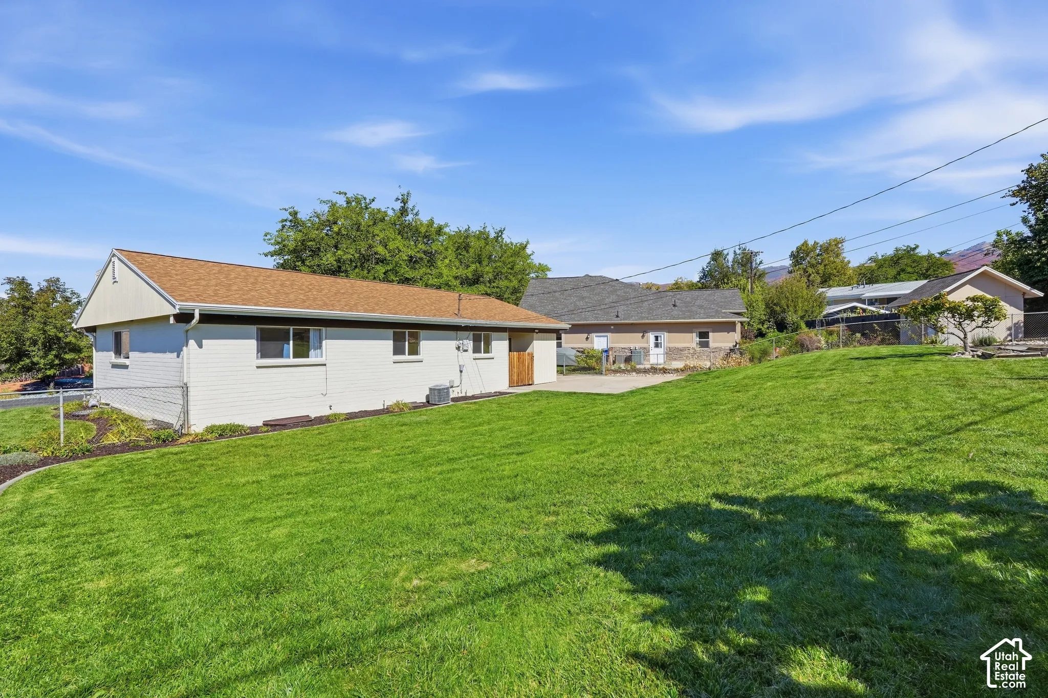 Expansive green lawn with a gentle slope