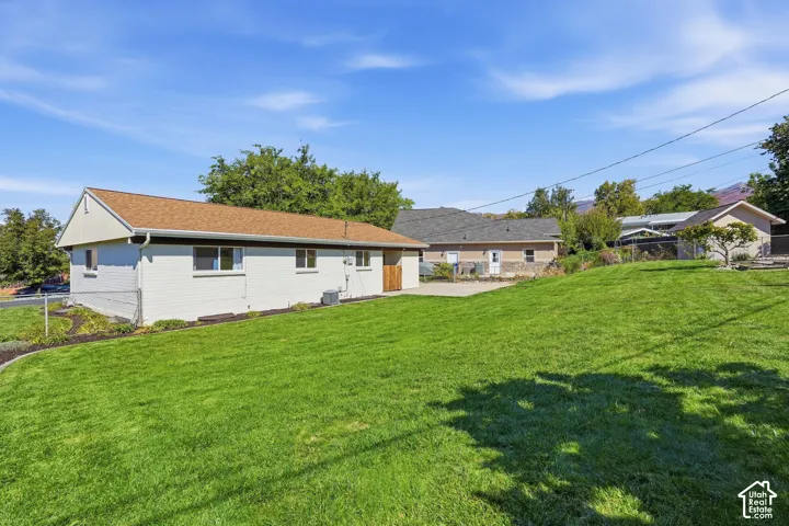 Expansive green lawn with a gentle slope
