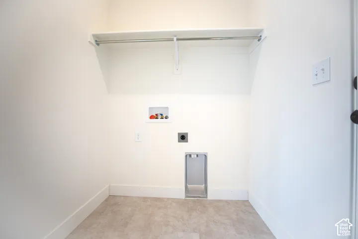 Full-size, dedicated laundry room with washer/dryer hookups adjacent to kitchen and garage.