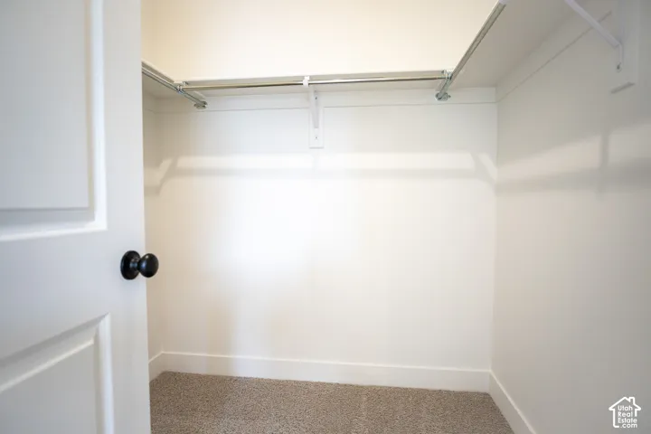 Large walk-in closet as part of primary suite.