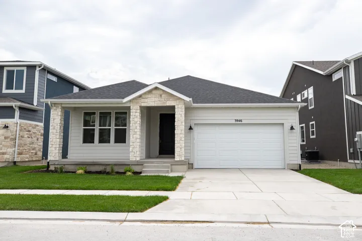 Granite Elevation B with extended porch and front yard landscaping installed.