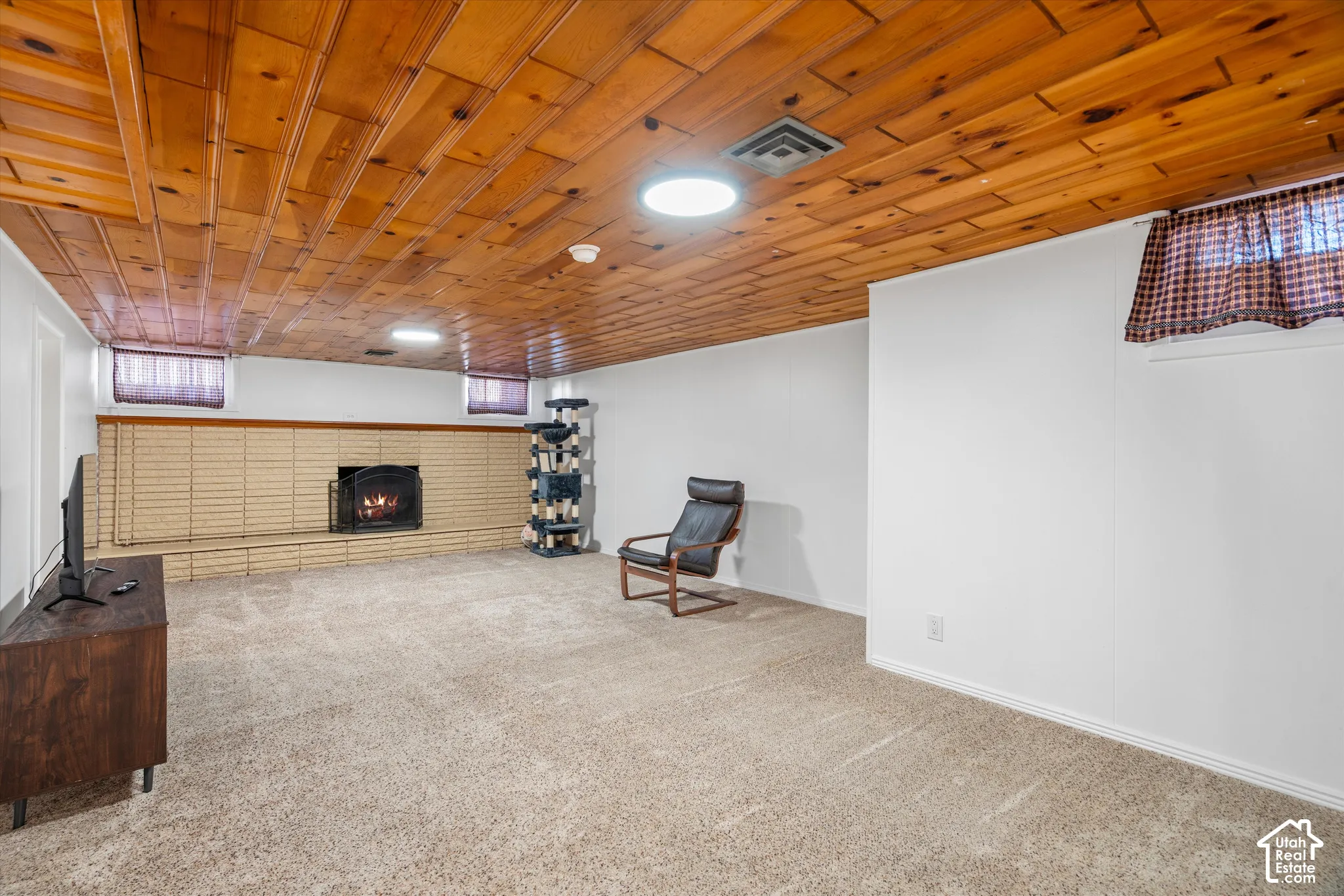 Wood-paneled ceiling with recessed lighting