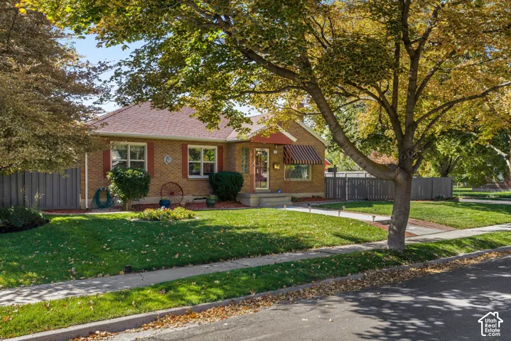 Brick exterior with a red shingle roof
