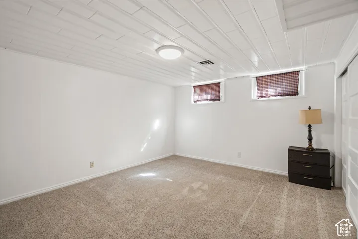 Plank-paneled ceiling with an attached flush-mount light fixture