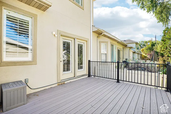 Expansive outdoor deck with composite decking and black metal railings