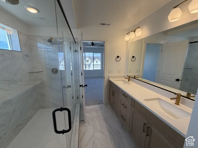 Walk-in shower with full-height tile surround and built-in bench