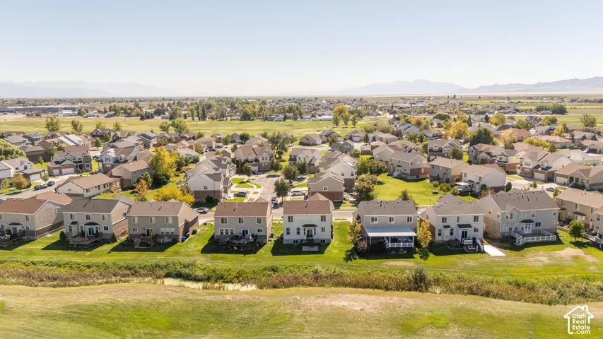 Residential neighborhood featuring numerous detached homes with varied architectural styles and surrounding green spaces