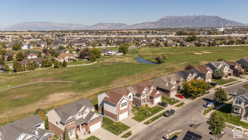 Expansive green space and mountain backdrop