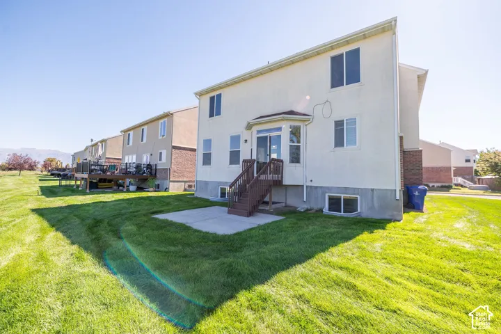 Expansive rear yard with a concrete patio