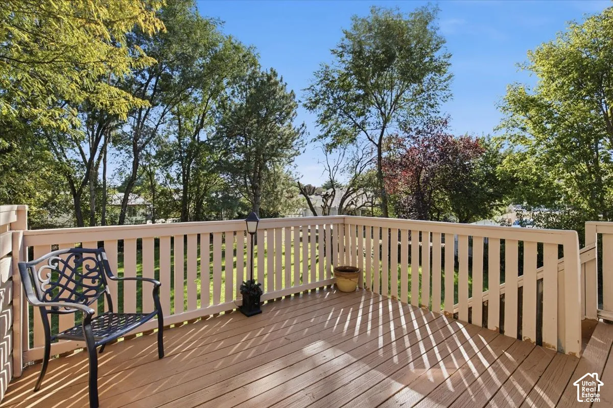 Wood-finish deck with white railings