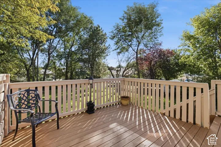 Wood-finish deck with white railings
