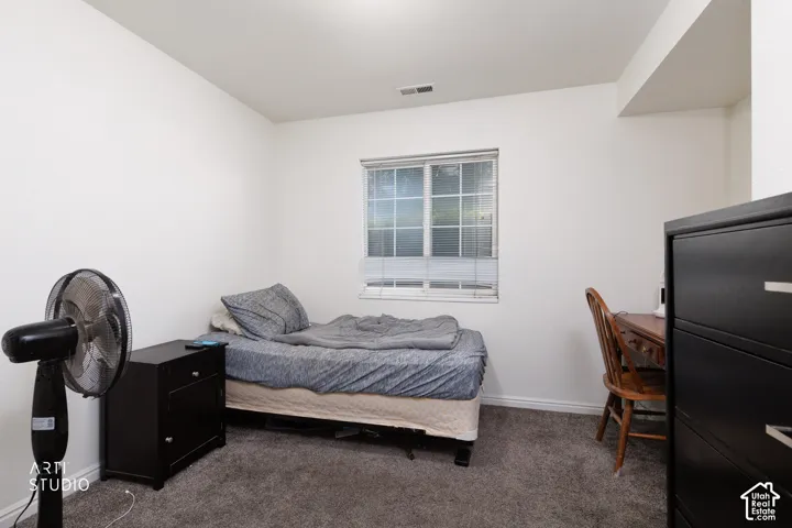 Neutral-toned walls and plush gray carpeting