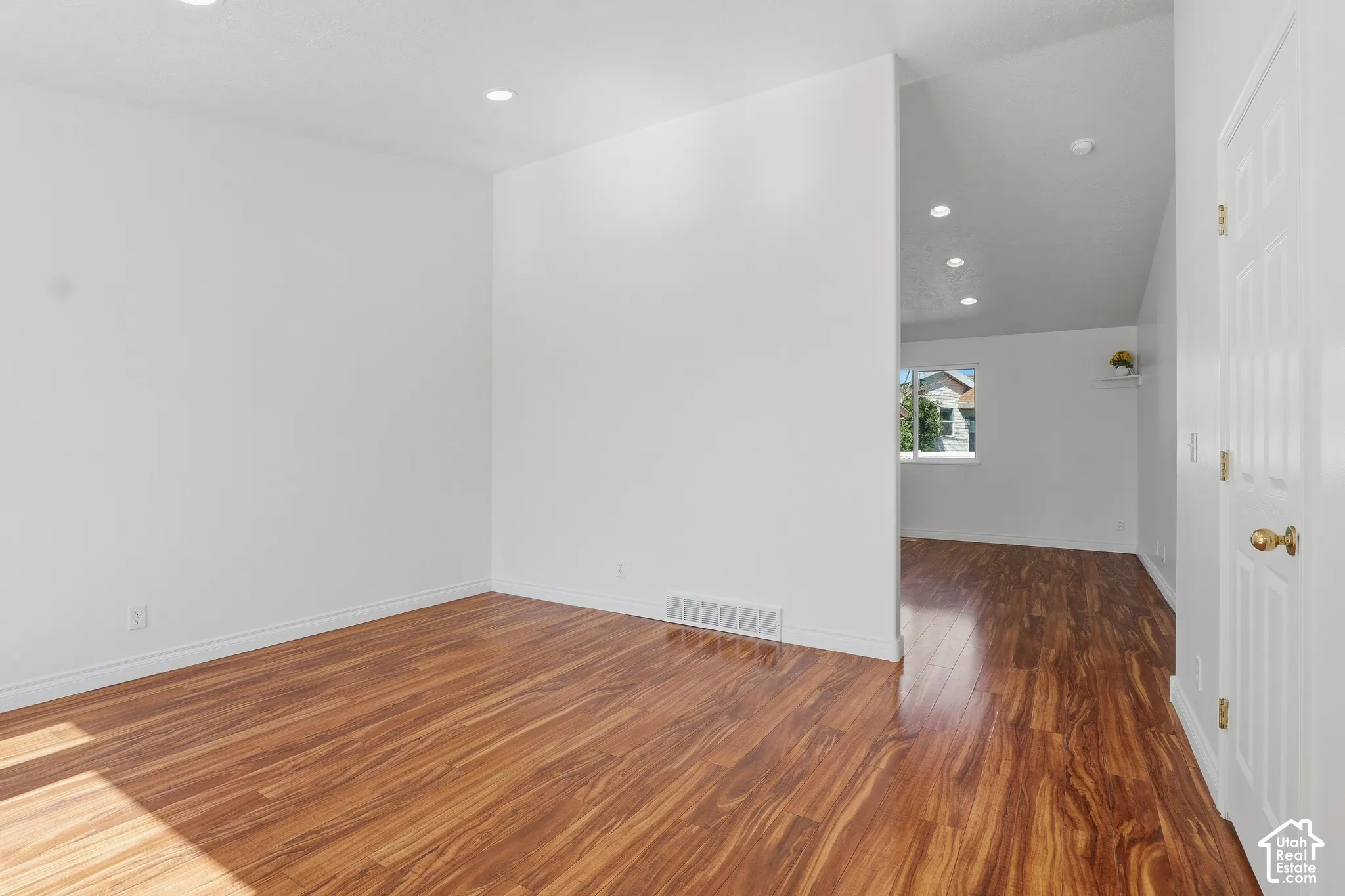Recessed ceiling lighting, and a window providing natural illumination