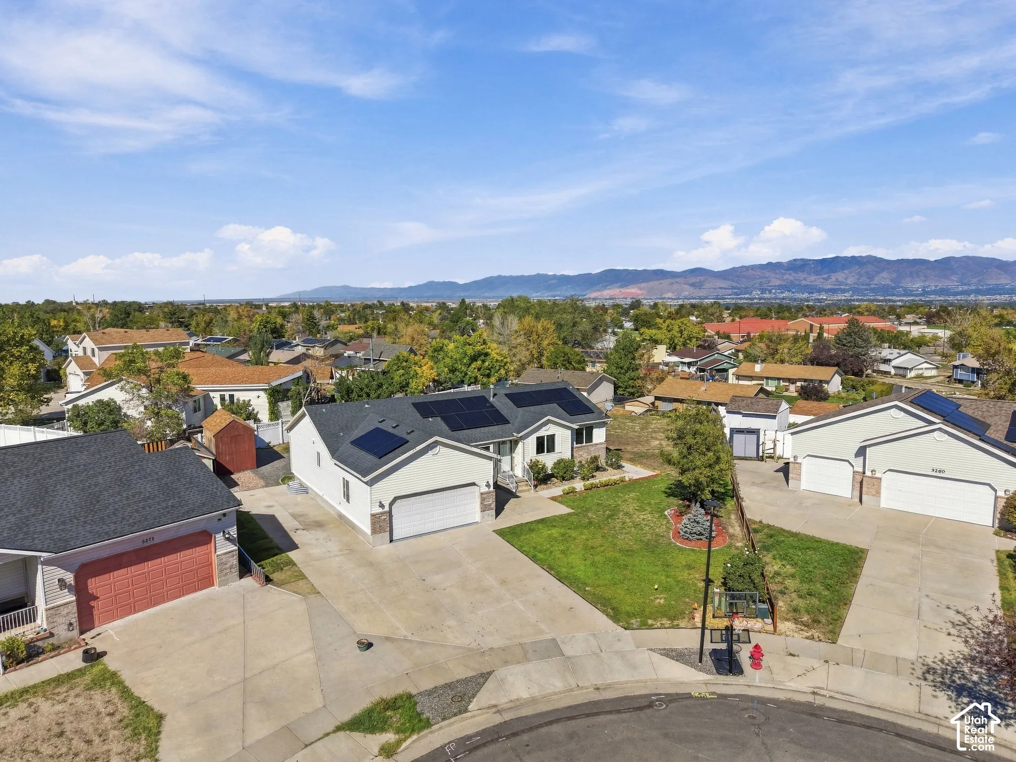 Neighborhood setting with mountain backdrop