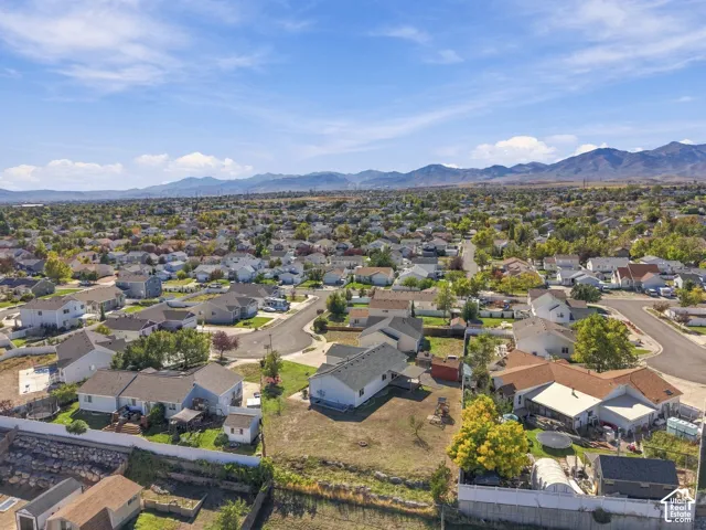 Expansive neighborhood with widespread residential development and distant mountain ranges