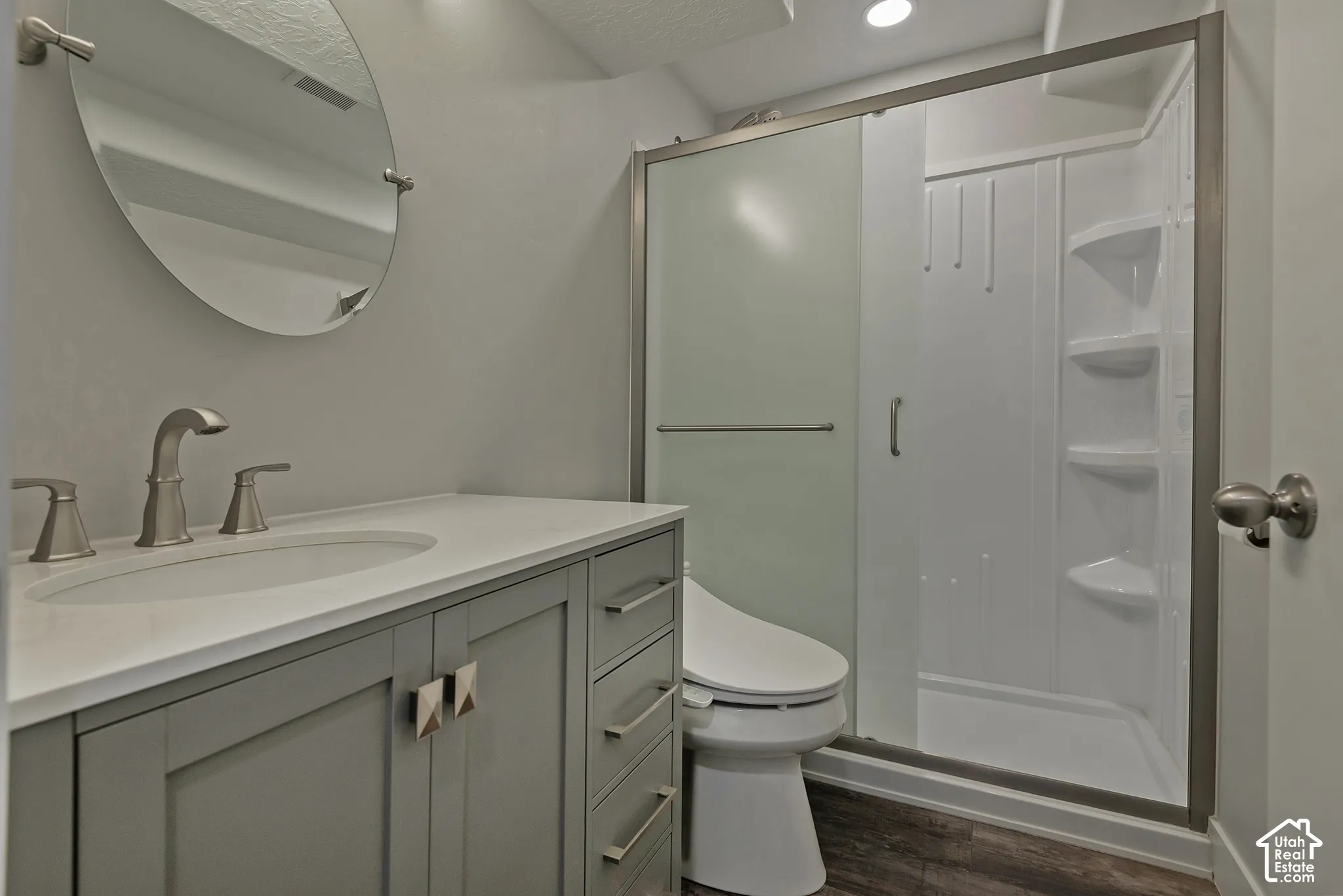 Contemporary vanity with a light-colored countertop and undermount sink
