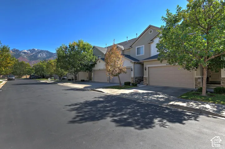 Stucco and stone exterior with a two-car garage