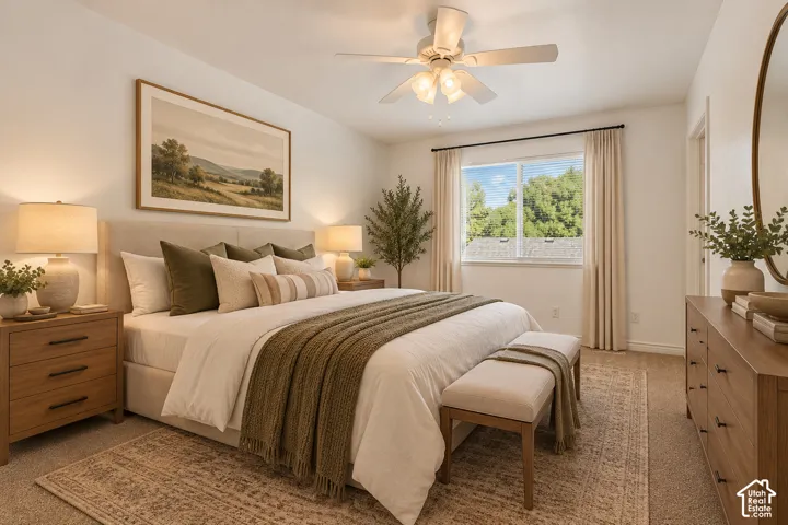 Neutral-toned carpeted flooring, window with natural light exposure, and a ceiling fan with integrated lighting