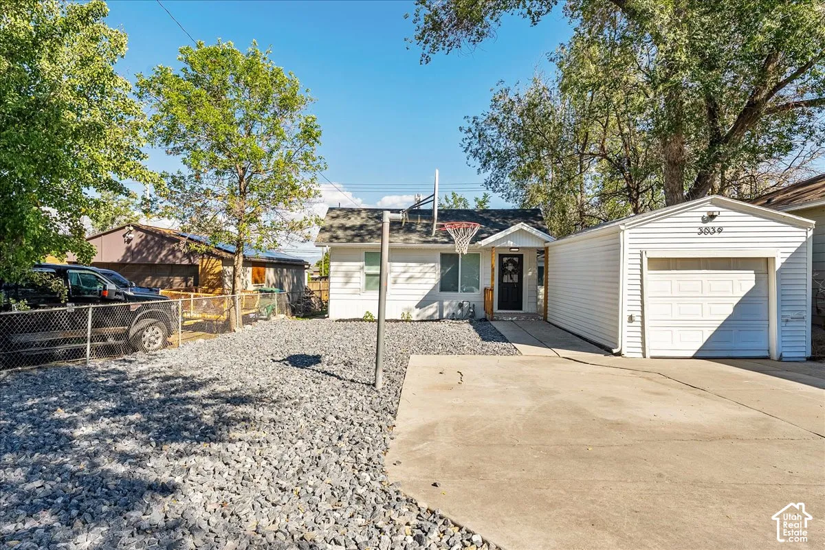 Attached single-car garage with a white panel door