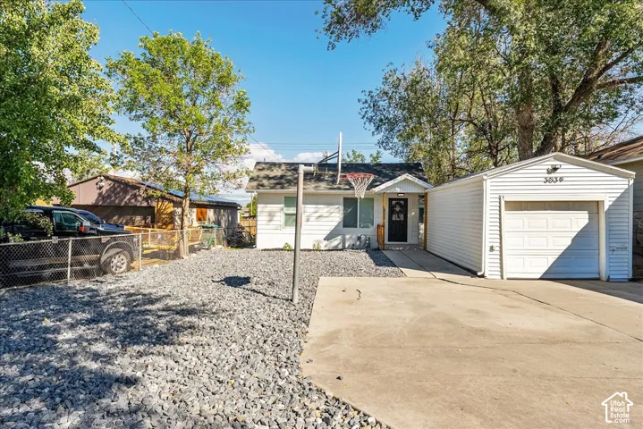Attached single-car garage with a white panel door