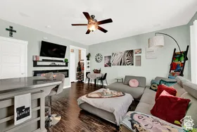 Wood-finish flooring, ceiling fan, and built-in fireplace