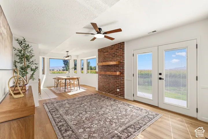 Wood-finish flooring throughout, with a recessed dining area featuring a bay window