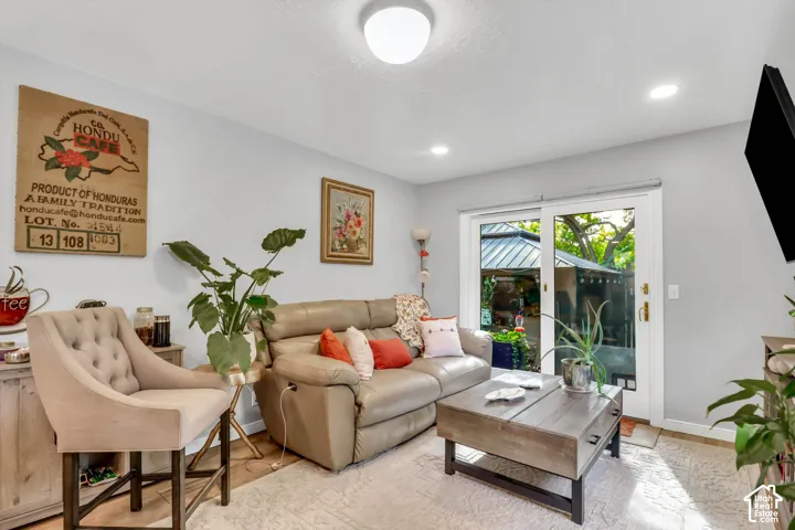 Light-toned walls, recessed lighting, and a ceiling-mounted fixture illuminate the interior