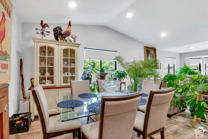 Vaulted ceiling with recessed lighting, large windows with roller shades, provide an abundance of natural light.