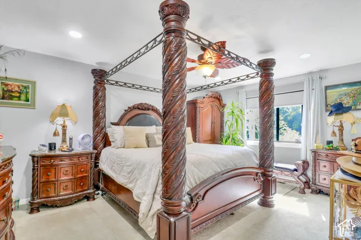 Recessed lighting, ceiling fan, and carpeted flooring