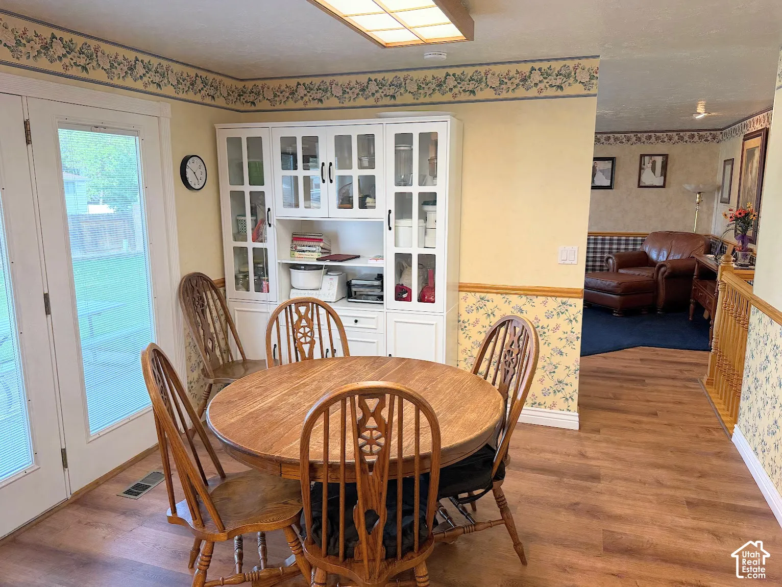 Wood-finish flooring throughout the dining area