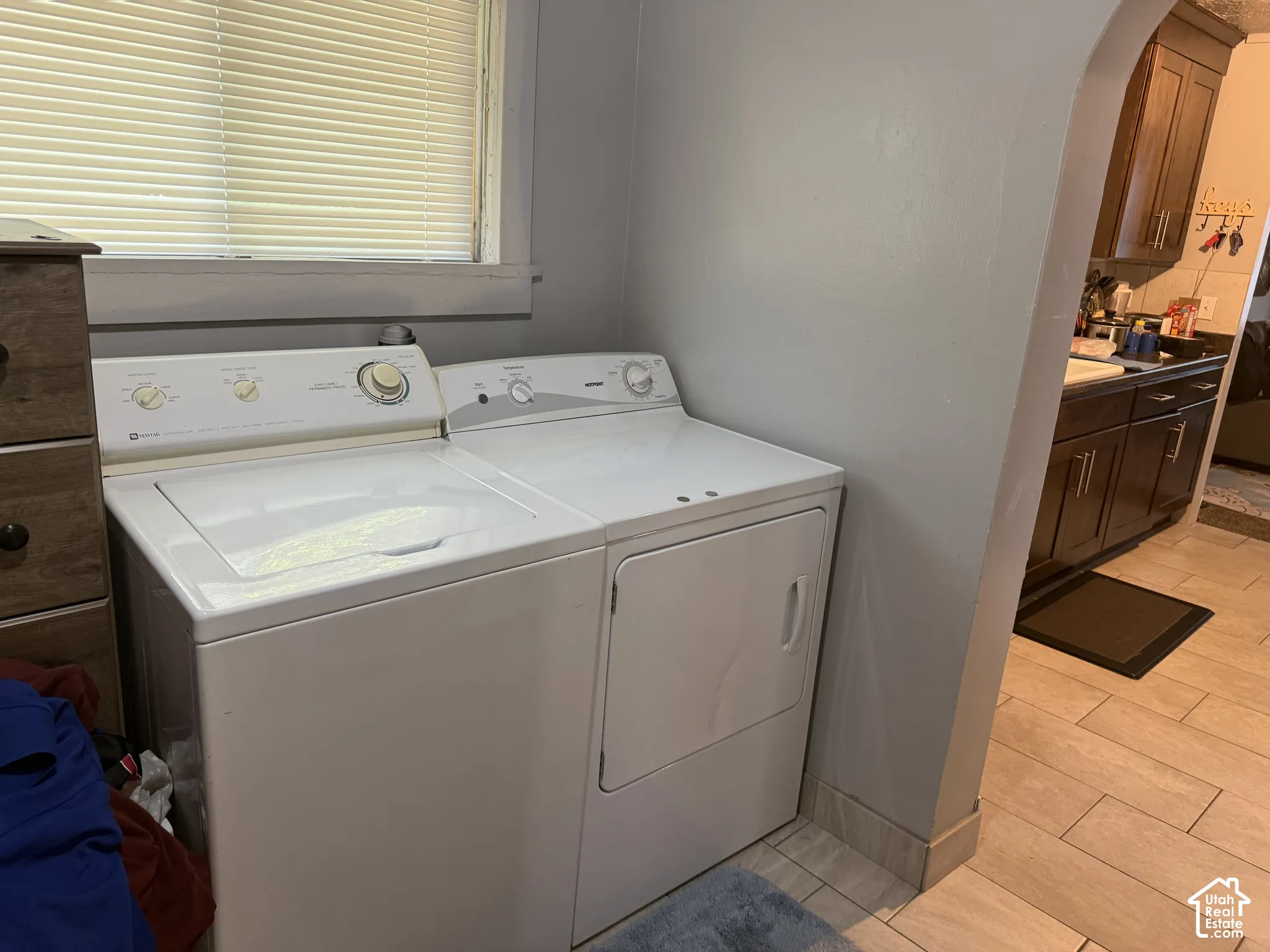 Dedicated laundry area featuring white appliances