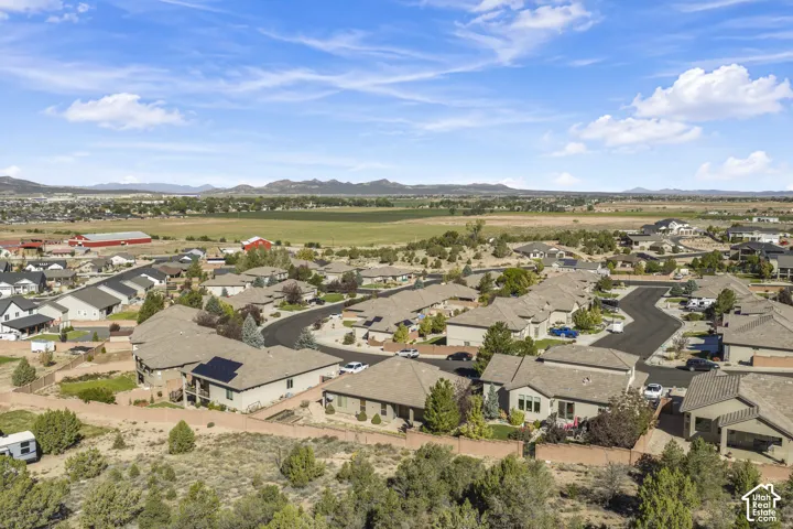 Residential community featuring single-story homes with solar panels and asphalt shingle roofs