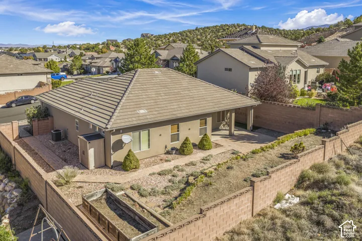 Exterior featuring a tiled roof, stucco siding, and a covered patio area