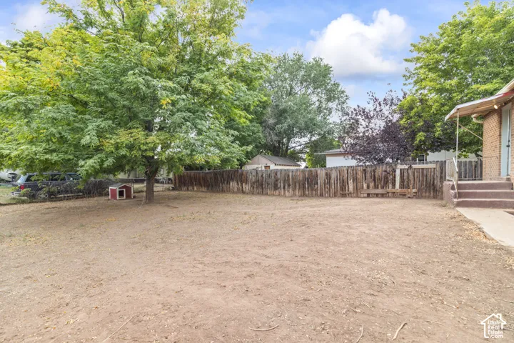 Fenced yard with mature trees