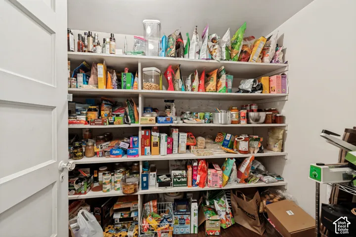 Built-in pantry shelving with multiple levels and compartmentalized storage