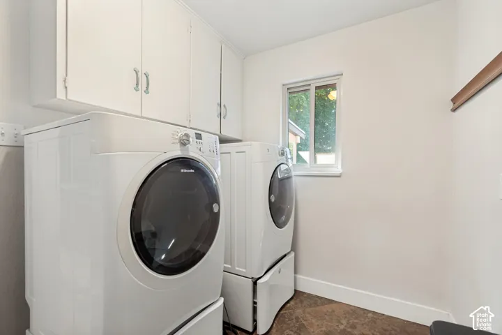 White upper cabinetry with silver hardware