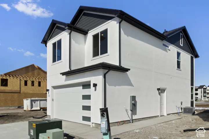 Modern white stucco exterior with dark trim accents