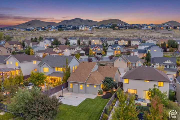 Residential community featuring a variety of architectural styles, mature landscaping, and mountain scenery