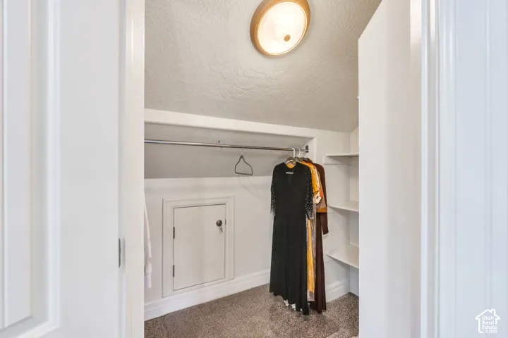 Spacious second-level walk-in closet offering an abundance of storage, with plenty of room to keep clothing, linens, games, and everyday essentials beautifully organized.