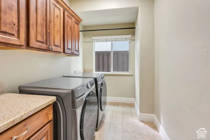 Built-in wood cabinetry, beautiful countertops, and modern washer and dryer (included with the home).