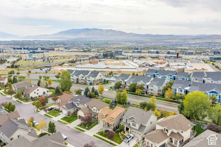 Traverse Mountain neighborhood with mature trees, established landscaping, and varied architectural styles