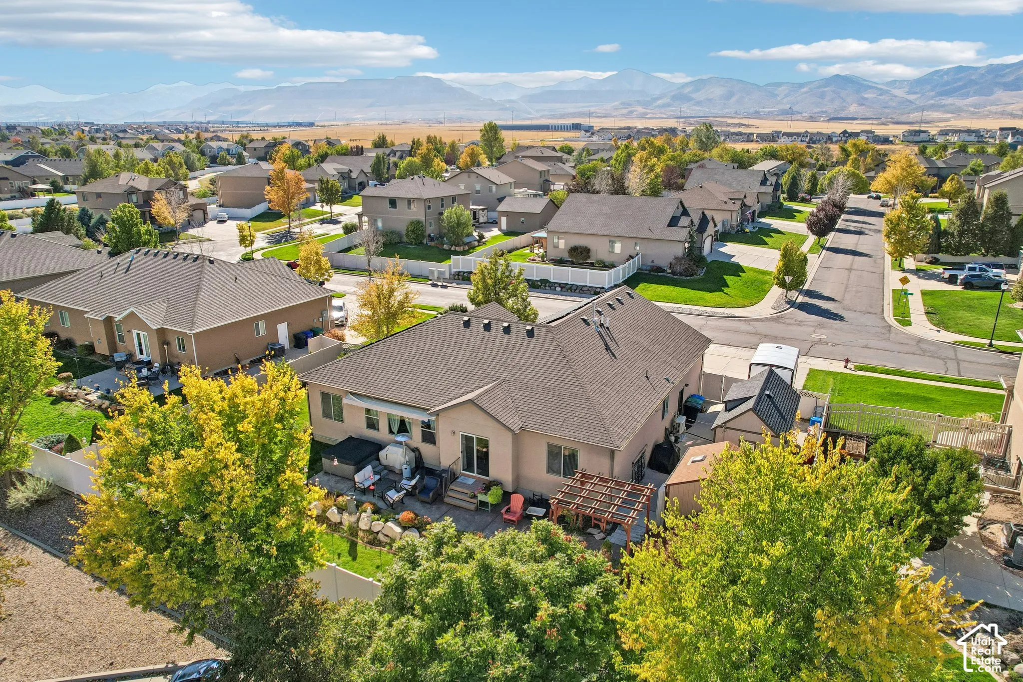 Expansive residential neighborhood with mature landscaping and mountain backdrop