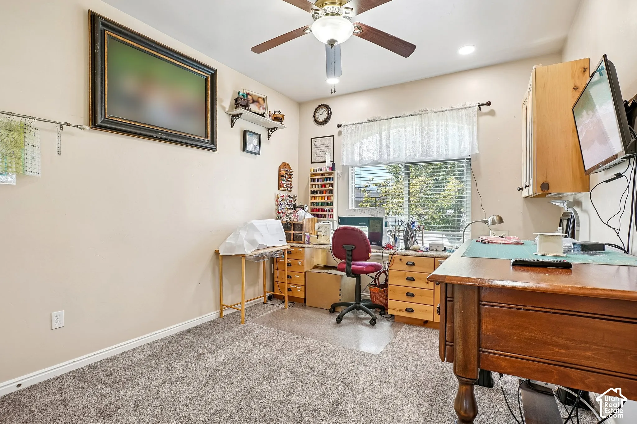 Recessed lighting, ceiling fan, carpeted flooring, window with blinds, and built-in cabinetry