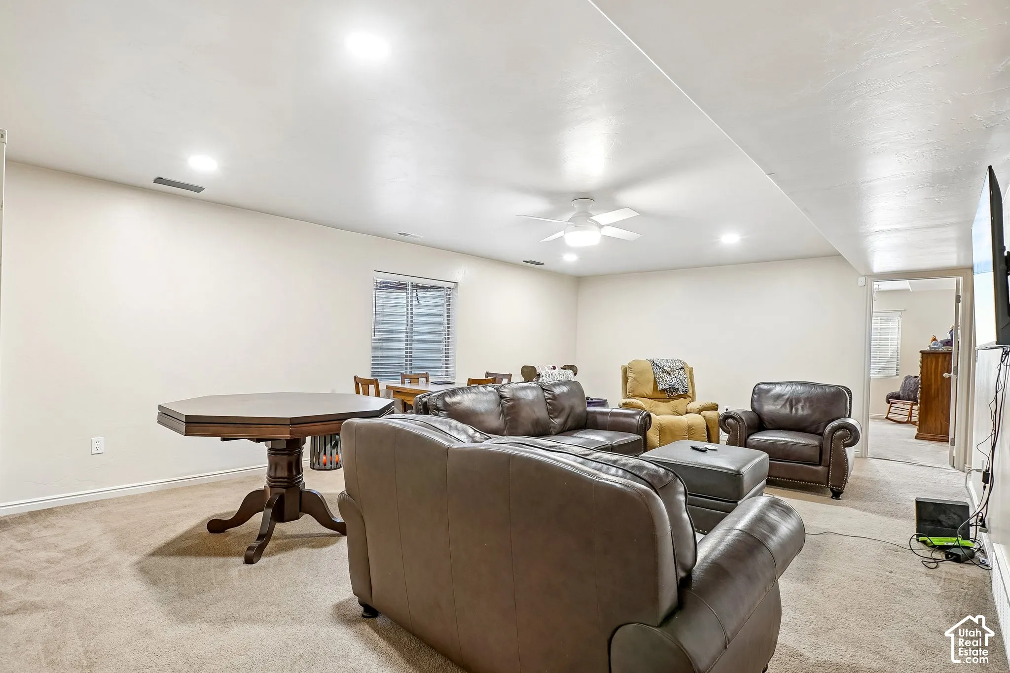 Recessed lighting throughout, ceiling fan, and carpeted flooring