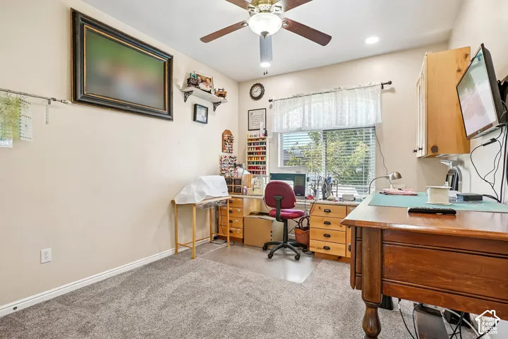 Recessed lighting, ceiling fan, carpeted flooring, window with blinds, and built-in cabinetry
