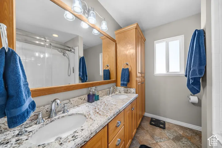 Double vanity with integrated sinks and chrome fixtures