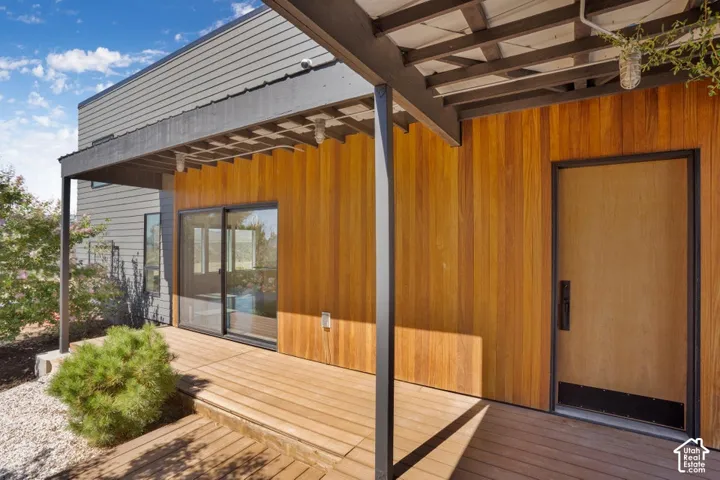 Wood-finish siding with a wood-finish deck